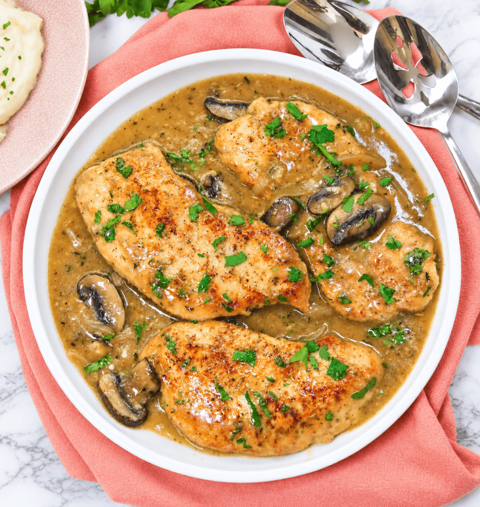 A large bowl of freshly smothered turkey chops for an easy twist on Thanksgiving dinner for a smaller family gathering.