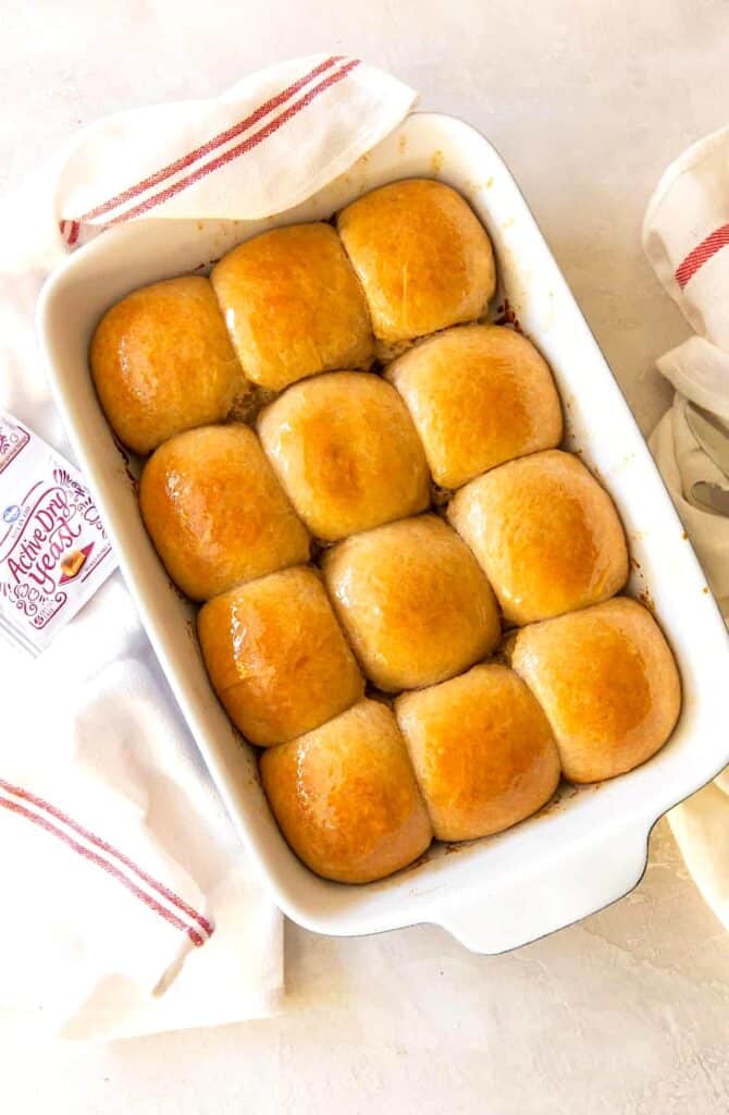 A batch of freshly baked honey wheat rolls ready to complement a holiday dinner.