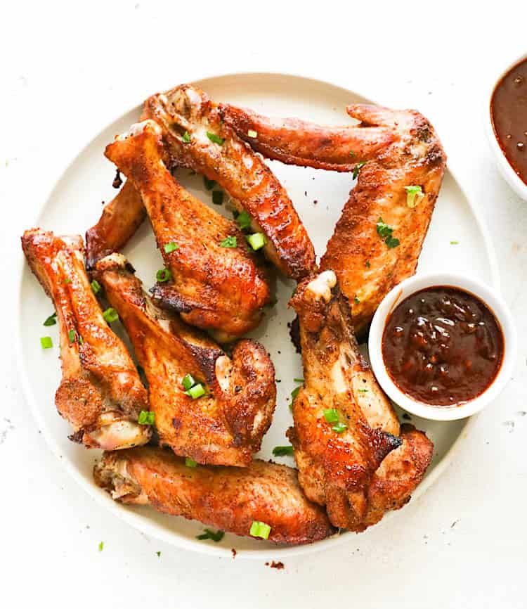 Getting ready to dive into a plate of roast turkey wings with a spicy honey garlic sauce.