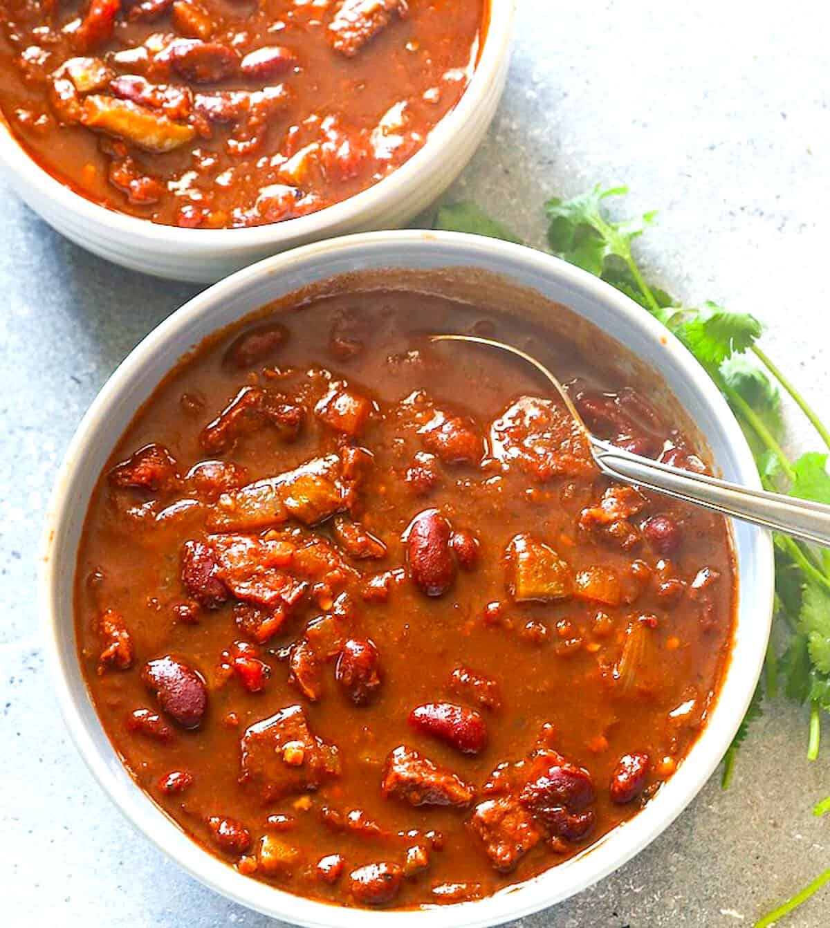 Serving up freshly simmered chili made with smoked brisket.